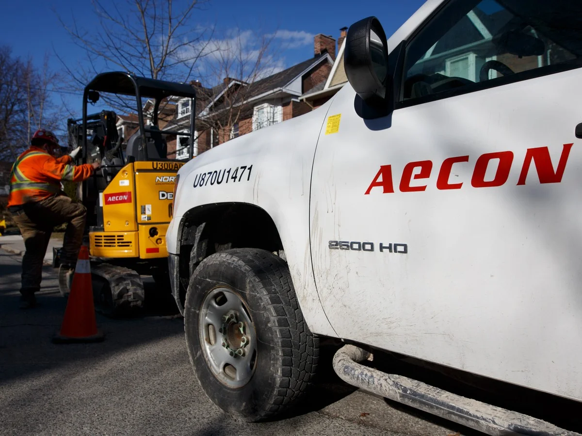 Aecon Group Inc. signage is displayed on a truck parked at a construction site in Toronto, Ont.